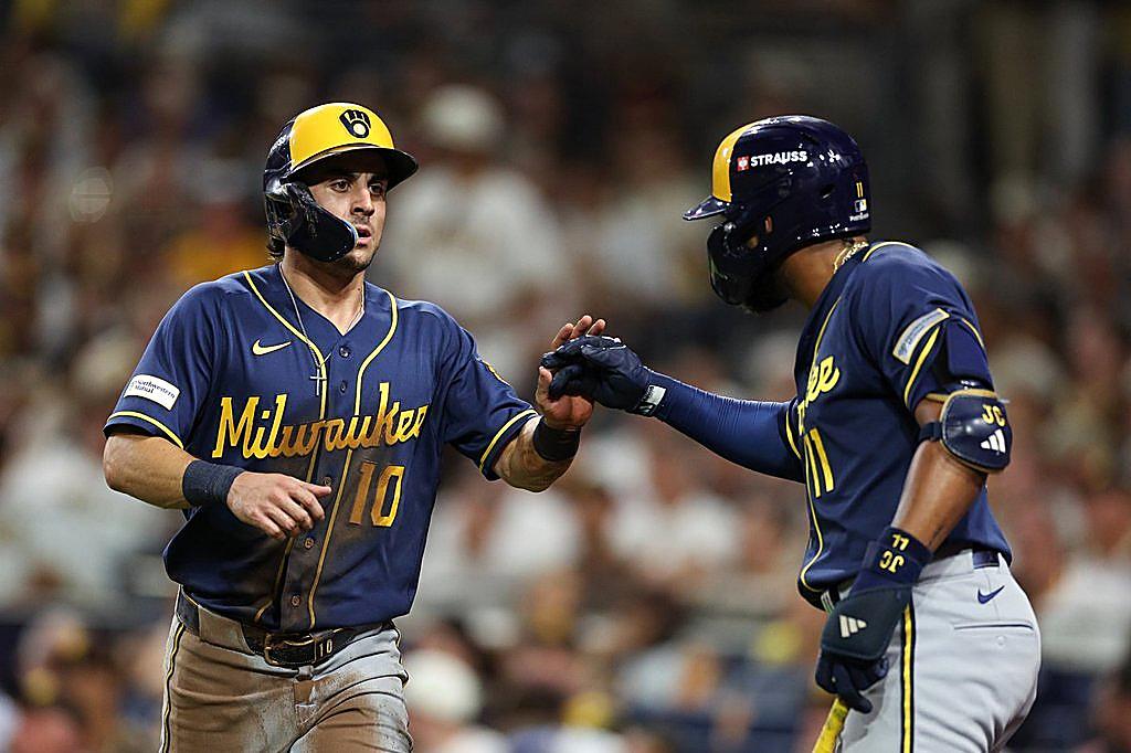 Milwaukee Brewers players meet after a run in the series that sent them to the NLCS.