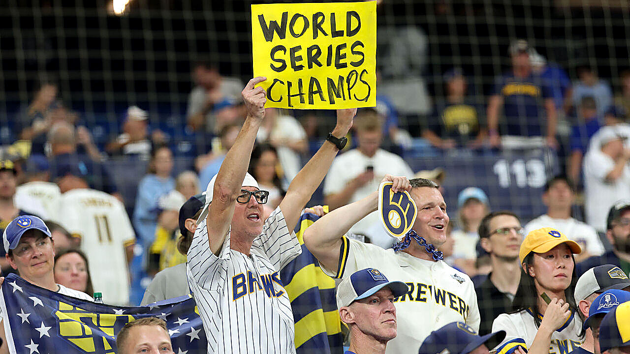 Brewers fans at Tropicana Field after Game 5, Wednesday, Oct. 28, one holding a sign that reads World Series champs. It is not Friday's parade in Milwaukee. This caption does not name a face.