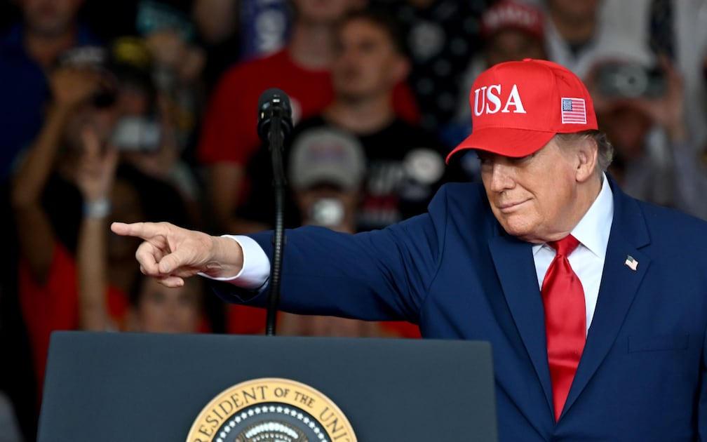 President Trump points from the Dalton podium and tells the crowd to pretend he is on the ballot.