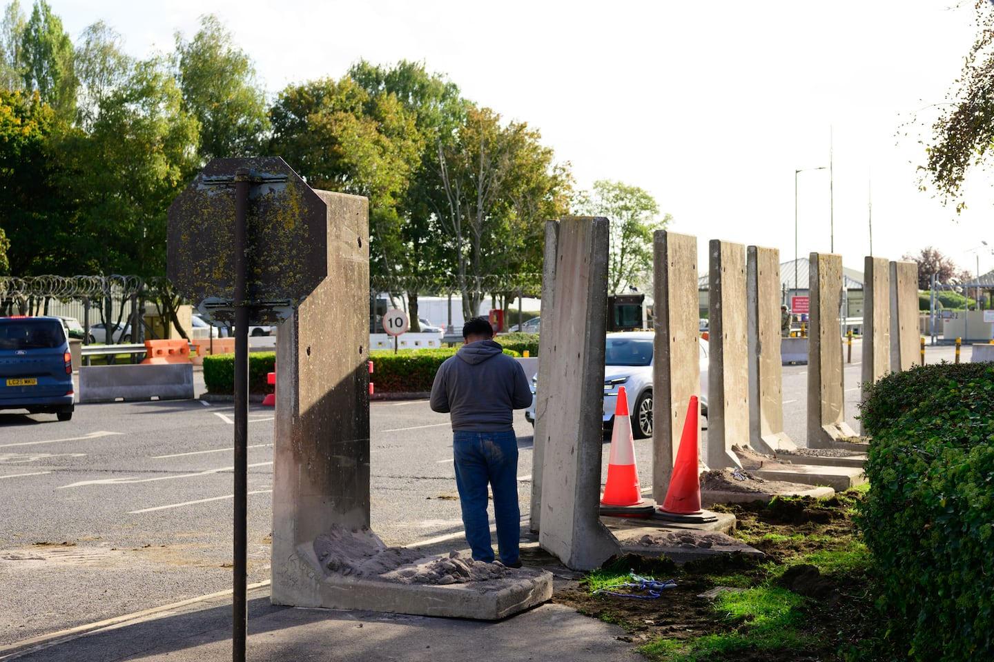 Concrete barriers stood at R.A.F. Fairford after police arrested a 25-year-old British-Iranian man in London.