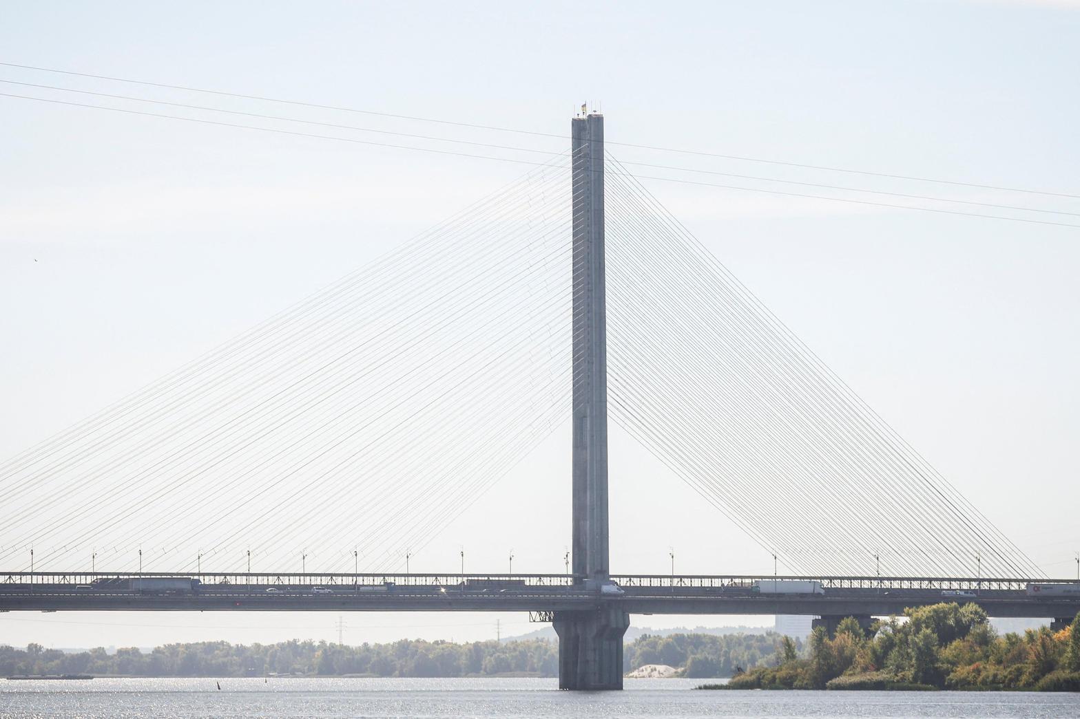 A bridge over the Dnipro in Kyiv. Russian drones closed two crossings Friday morning and killed one person in a residential building.