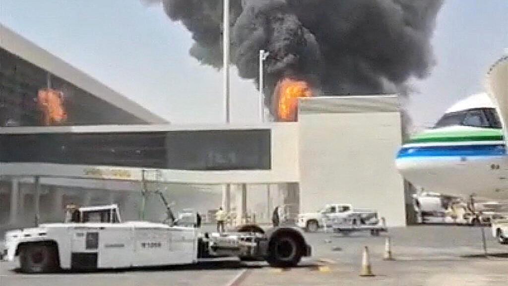 Fire and smoke rise at King Khalid International Airport in Riyadh after a Houthi strike.