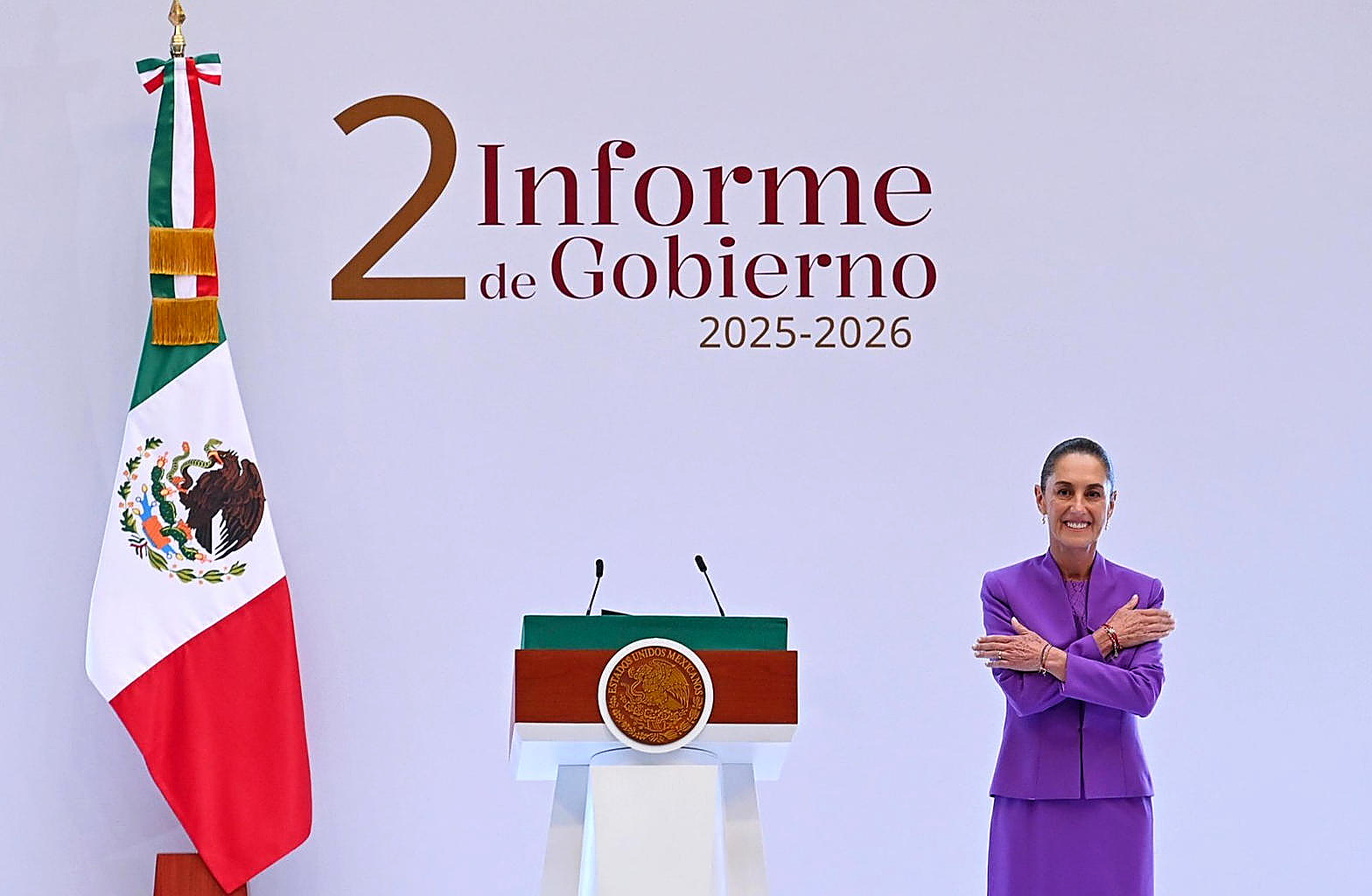 President Claudia Sheinbaum at the podium, full color, Mexican flag at her shoulder. Wire photograph.