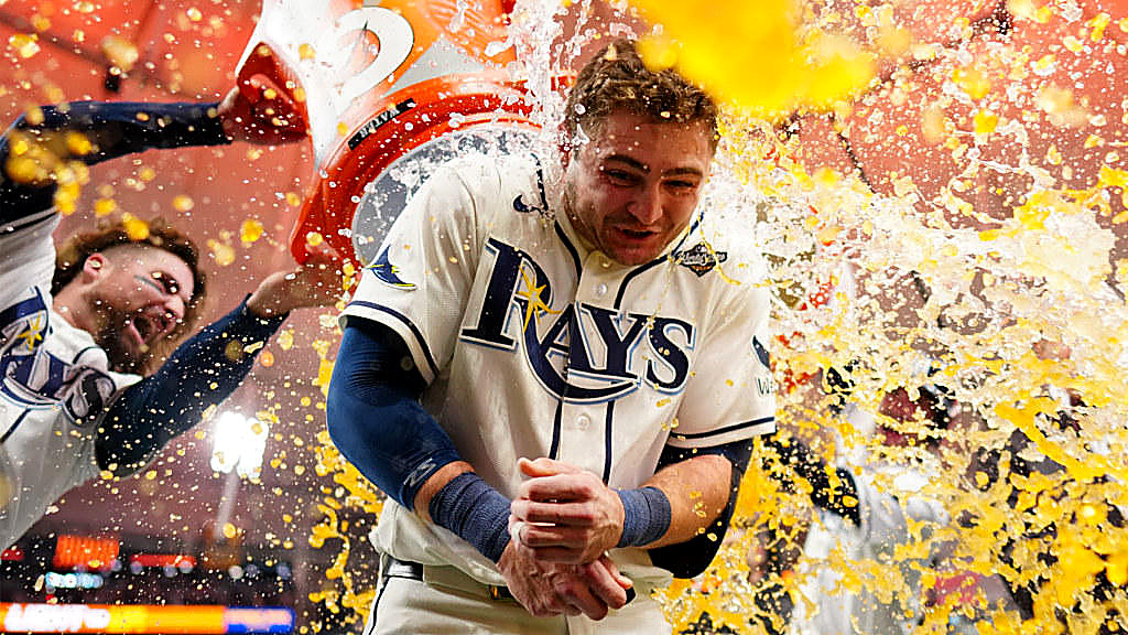 Ben Williamson, in a white Rays jersey, is doused after a walk-off. His face is in the frame.