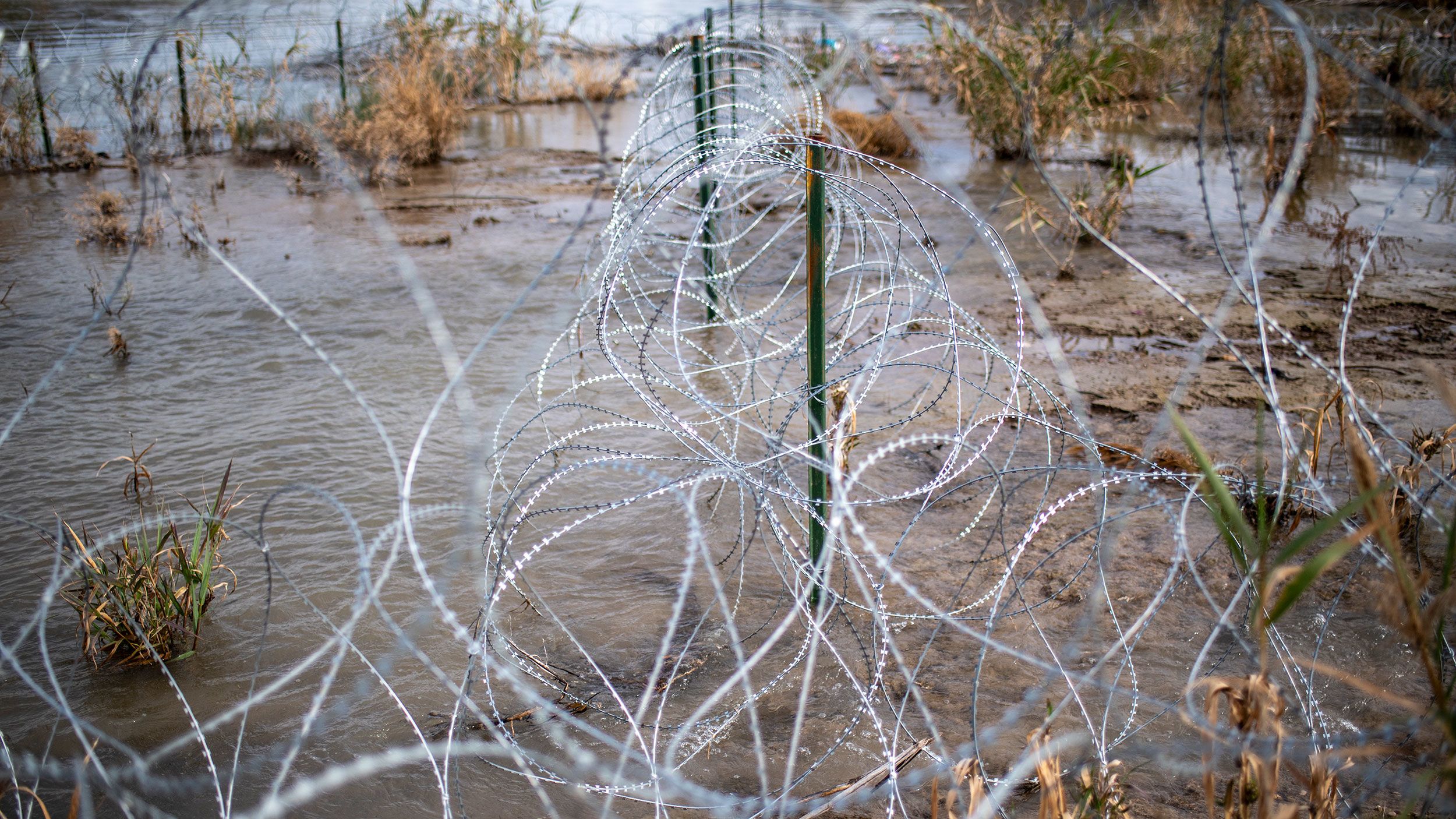 Razor wire is seen near the Rio Grande on February 3, 2024 at Shelby Park in Eagle Pass, Texas.