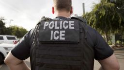 FILE - A U.S. Immigration and Customs Enforcement (ICE) officer looks on during an operation in Escondido, Calif., July 8, 2019. Data broker LexisNexis Risk Solutions allegedly violated Illinois law by collecting and combining extensive personal information and selling it to third parties including federal immigration authorities, according to a lawsuit filed Tuesday, Aug. 16, 2022, by immigration advocates. (AP Photo/Gregory Bull, File)